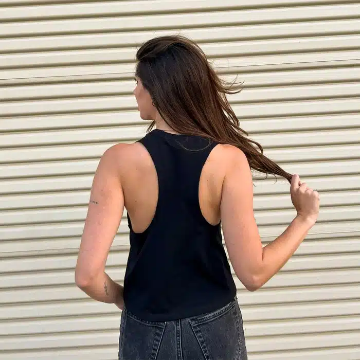 Model wearing the Black Flagship Racerback Tank