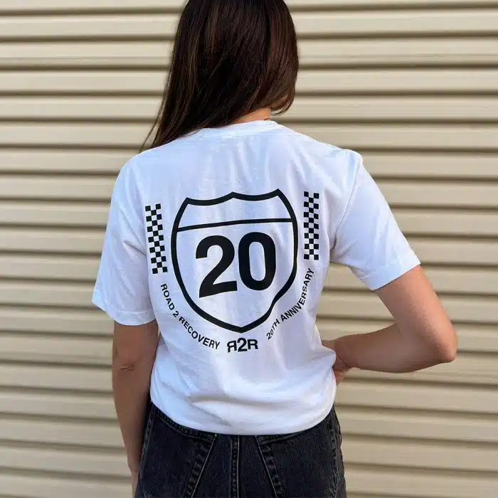 Female model wearing R2R 20th Anniversary Tee