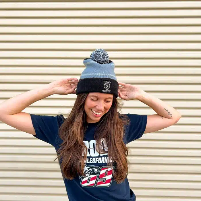 Model wearing Tri-Tone Striped Pom Beanie